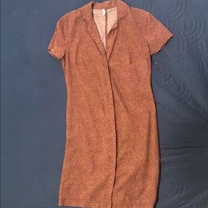 A tight button up, brown polka dot dress.